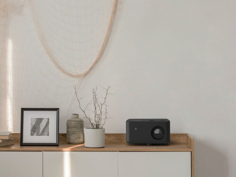 Optoma 4K home projector showcasing cinematic visuals in a modern living room